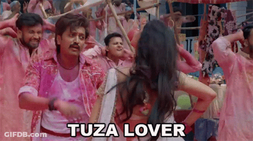 A Man And A Woman Are Dancing In Front Of A Crowd With The Words Tuza Lover Above Them GIF