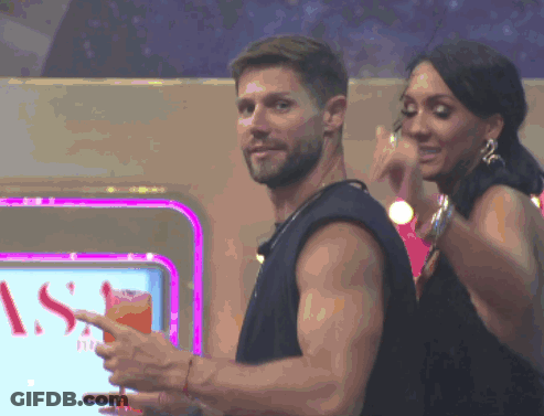 Man And Woman Dancing In Front Of S Sign GIF