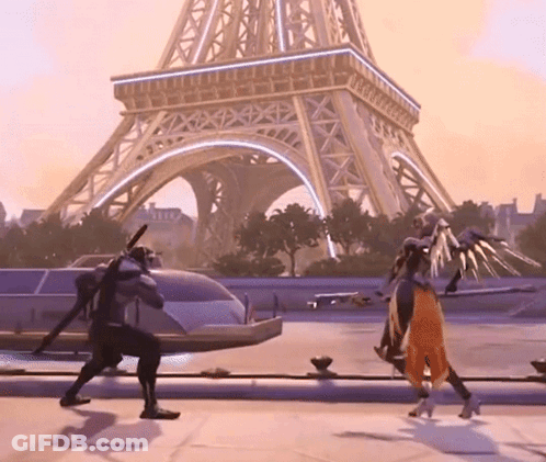 A Man And A Woman Are Dancing In Front Of The Eiffel Tower .. GIF