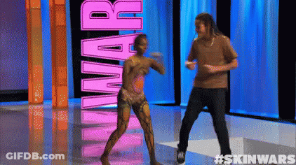 A Man And A Woman Are Dancing In Front Of The Word Skin Wars GIF