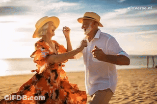 A Man And A Woman Are Dancing On A Beach GIF