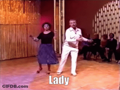A Man And A Woman Are Dancing On A Dance Floor And The Word Lady Is On The Floor GIF