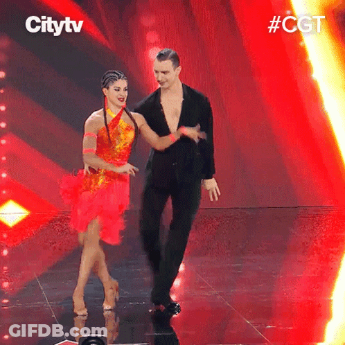 A Man And A Woman Are Dancing On A Stage With Citytv Written On The Bottom GIF