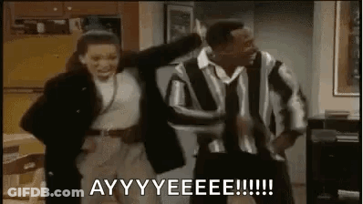 A Man And A Woman Are Dancing Together In A Living Room In A Room . GIF