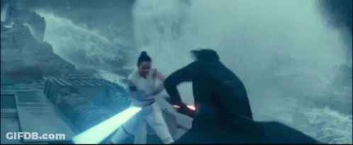 A Man And A Woman Are Fighting Each Other With Lightsabers . GIF