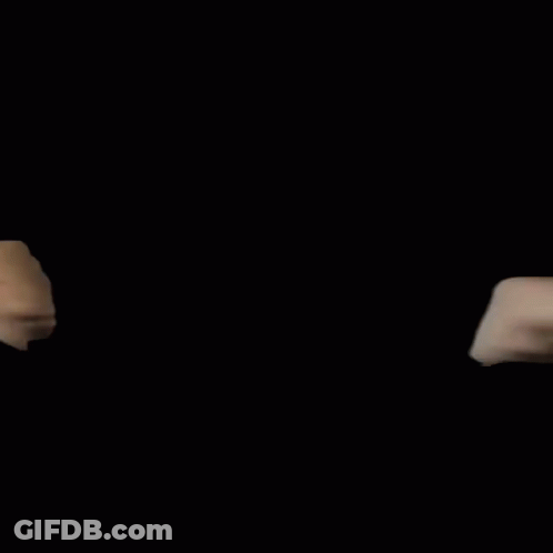 A Man And A Woman Are Giving Each Other A Fist Bump Against A Black Background GIF