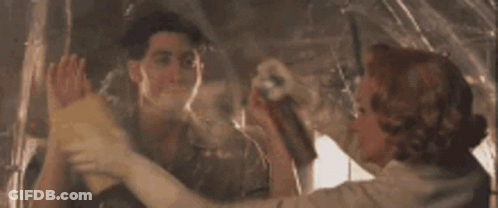 A Man And A Woman Are Giving Each Other A High Five In A Painting . GIF