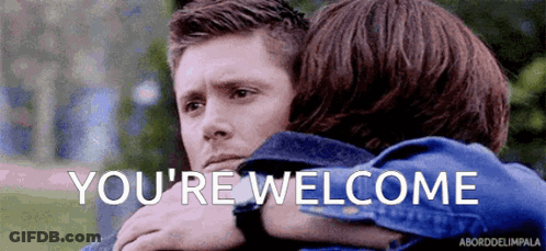 A Man And A Woman Are Hugging Each Other And The Words `` You 'Re Welcome '' Are Written On The Screen . GIF