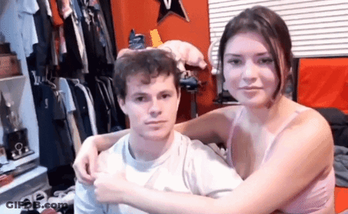 Man And Woman Hugging In Bedroom GIF