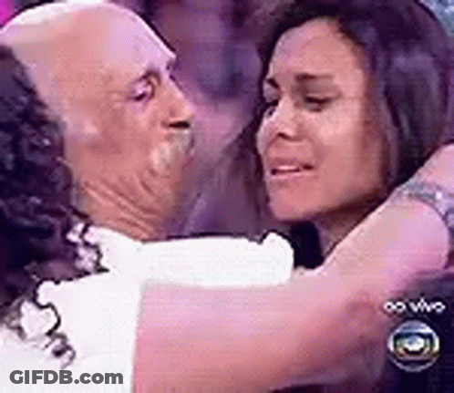 Man And Woman Hugging In Purple Room GIF
