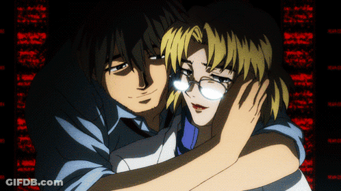 A Man And A Woman Are Hugging Each Other In Front Of A Screen That Says ' I Love You ' On It GIF