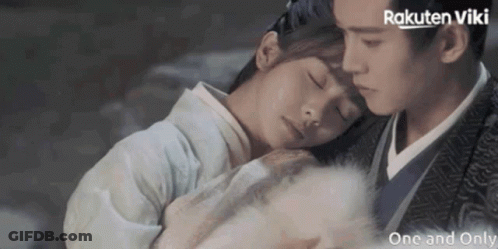 A Man And A Woman Are Hugging Each Other With Rakuten Viki Written On The Bottom Right GIF