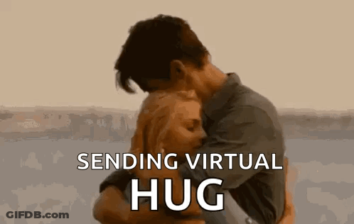 A Man And A Woman Are Hugging Each Other With The Words `` Sending Virtual Hug '' . GIF