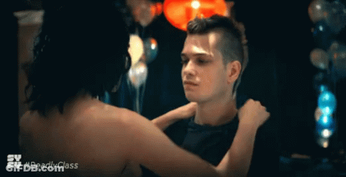 A Man And A Woman Are Hugging In A Scene From The Tv Series Deadly Class GIF