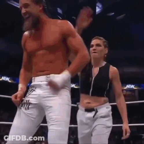 A Man And A Woman Are In A Boxing Ring . GIF