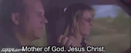 A Man And A Woman Are In A Car And The Woman Says Mother Of God Jesus Christ . GIF