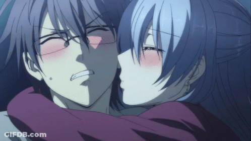 A Man And A Woman Are Kissing And The Woman Is Making A Funny Face GIF