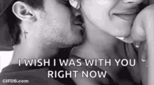 A Man And A Woman Are Kissing In A Black And White Photo . The Man Has A Cross Tattoo On His Neck . GIF