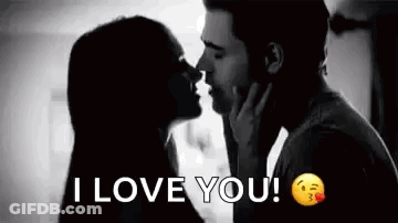 A Man And A Woman Are Kissing In A Black And White Photo With The Words `` I Love You '' . GIF