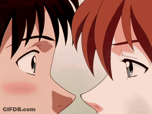 A Man And A Woman Are Kissing In A Cartoon GIF