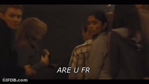 A Man And A Woman Are Kissing In A Dark Room With The Words `` Be Fucking Fr '' Written Above Them . GIF