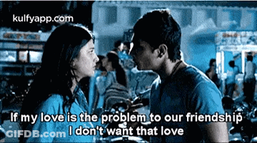 A Man And A Woman Are Kissing In Front Of A Crowd And The Man Is Saying That His Love Is The Problem To Our Friendship . GIF