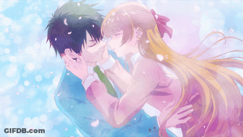 A Man And A Woman Are Kissing With Petals Flying Around Them GIF