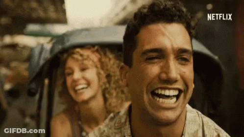 A Man And A Woman Are Laughing And Netflix Is Visible In The Corner GIF