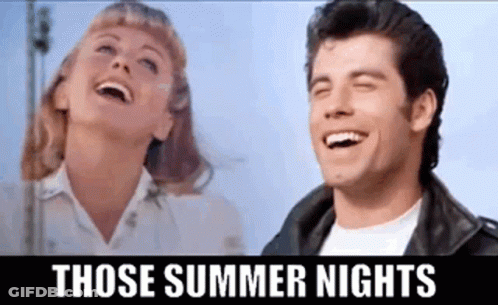A Man And A Woman Are Laughing Together In A Movie . GIF