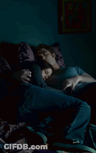 A Man And A Woman Are Laying On A Couch And The Woman Is Sleeping GIF