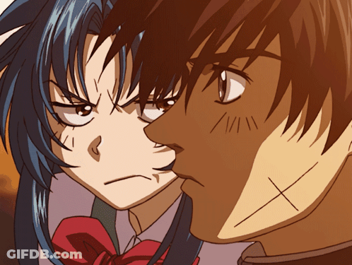 A Man And A Woman Are Looking At Each Other And The Man Has An X On His Forehead GIF