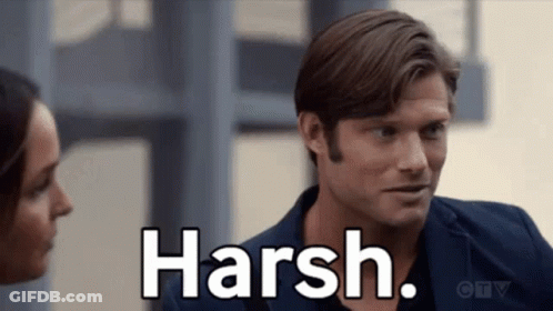 Man And Woman Looking At Each Other Saying Harsh GIF