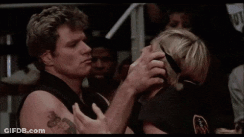 A Man And A Woman Are Looking At Each Other And The Man Is Saying `` No '' . GIF