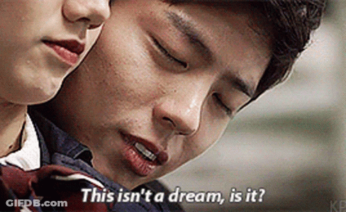 A Man And A Woman Are Looking At Each Other And The Man Is Saying This Isn 'T A Dream Is It GIF