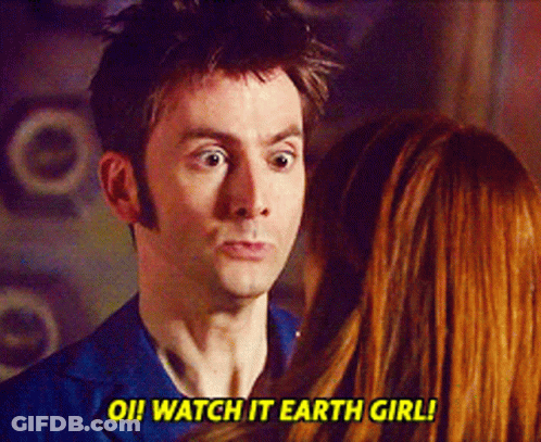 A Man And A Woman Are Looking At Each Other And The Man Says Watch It Earth Girl GIF