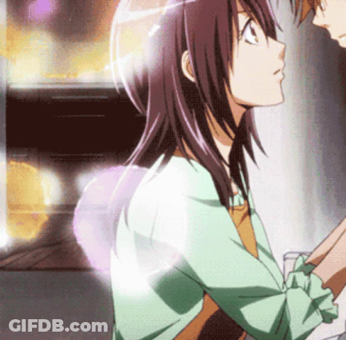 A Man And A Woman Are Looking At Each Other And The Woman Is Wearing A Green Jacket GIF