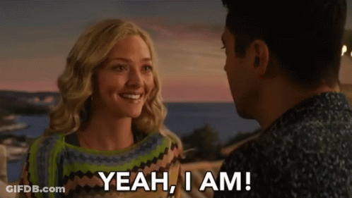 A Man And A Woman Are Looking At Each Other And The Woman Says " Yeah , I Am " GIF