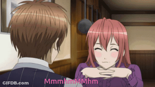 A Man And A Woman Are Looking At Each Other And The Words Mmmmhmmmhm Are Visible GIF