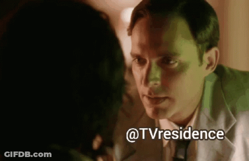 A Man And A Woman Are Looking At Each Other And The Words @Tvresidence Are Above Them GIF