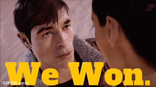 A Man And A Woman Are Looking At Each Other And The Words We Won Are Visible GIF