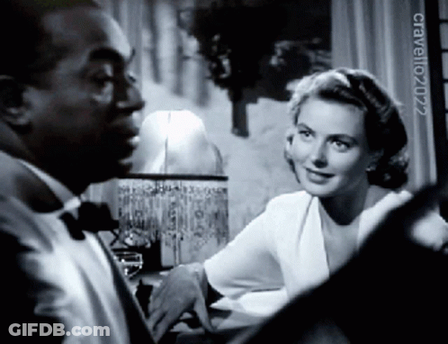 A Man And A Woman Are Looking At Each Other In A Black And White Photo Taken By Craveno2022 GIF