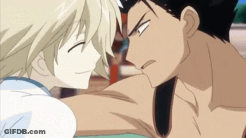 A Man And A Woman Are Looking At Each Other In A Cartoon GIF