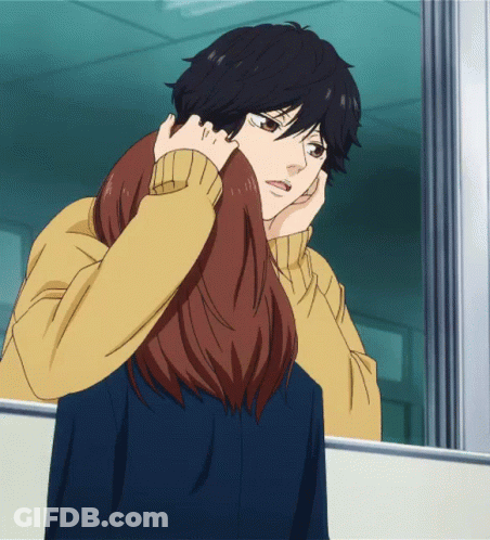 A Man And A Woman Are Looking At Each Other In A Mirror GIF