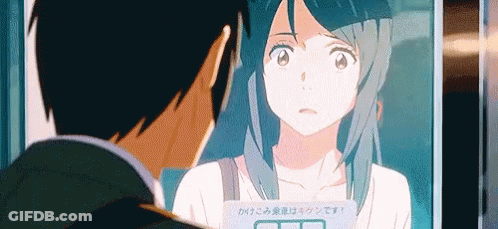 A Man And A Woman Are Looking At Each Other In A Mirror In An Anime . GIF