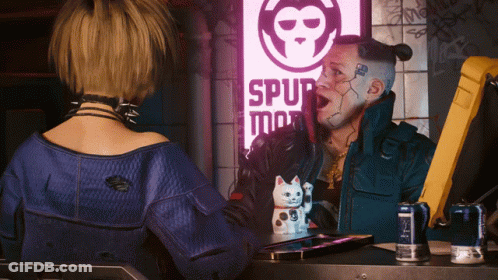 A Man And A Woman Are Looking At Each Other In Front Of A Sign That Says Spur GIF