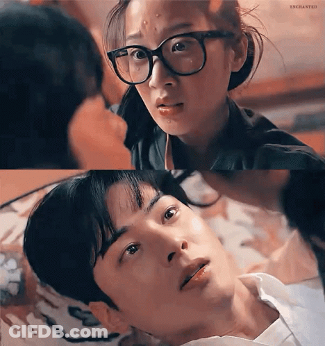 A Man And A Woman Are Looking At Each Other . The Woman Is Wearing Glasses . GIF