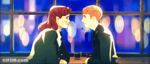 A Man And A Woman Are Looking At Each Other While Sitting At A Table GIF