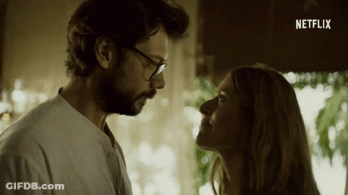 A Man And A Woman Are Looking At Each Other With A Netflix Logo In The Corner GIF