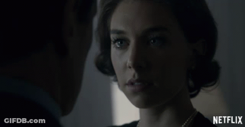 A Man And A Woman Are Looking At Each Other With A Netflix Logo In The Foreground GIF