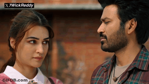 A Man And A Woman Are Looking At Each Other With A X7wick Reddy Logo In The Background GIF